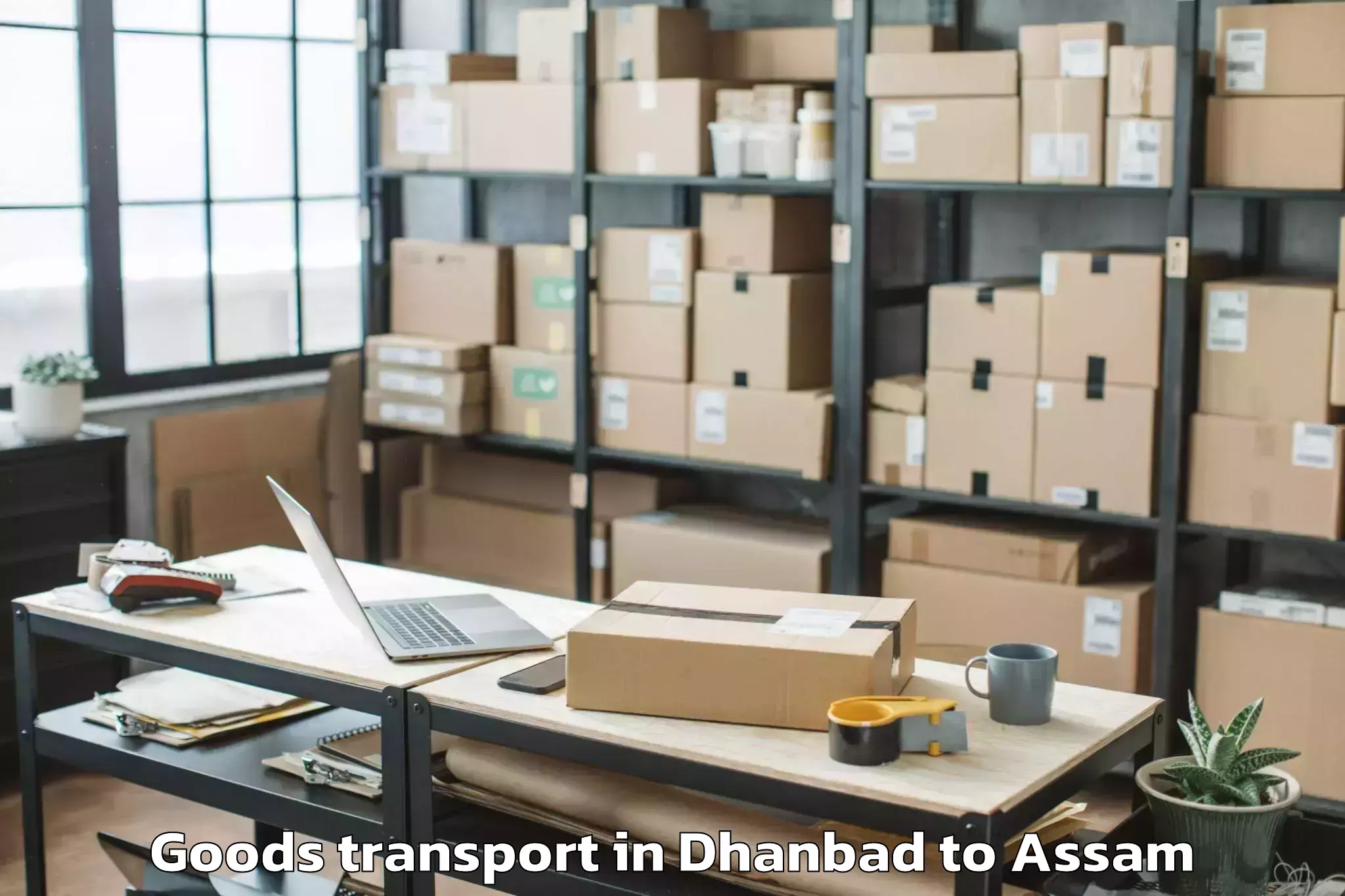 Easy Dhanbad to Laharighat Goods Transport Booking